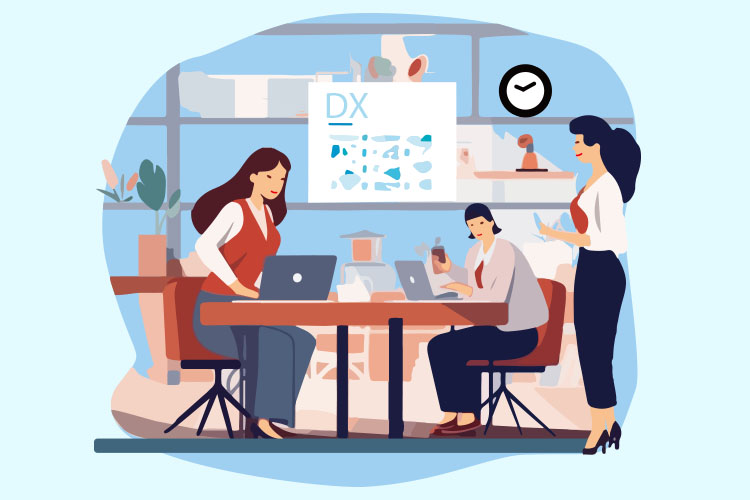 職場でPCを見ながら話し合う女性たち